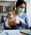 https://www.healthychildren.org/SiteCollectionImagesArticleImages/mother-with-face-protective-mask-working-from-home.jpg?csf=1&e=h3zfEg
